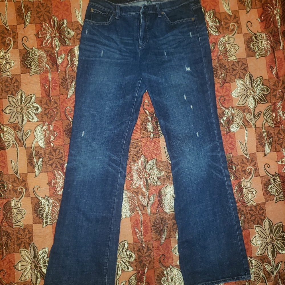 Distressed, flared leg jeans.